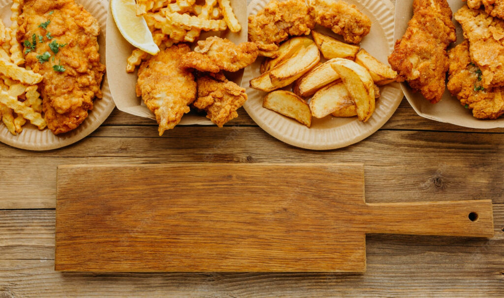Delicious Fish and Chips Spread on Rustic Table - Wallpaper Background