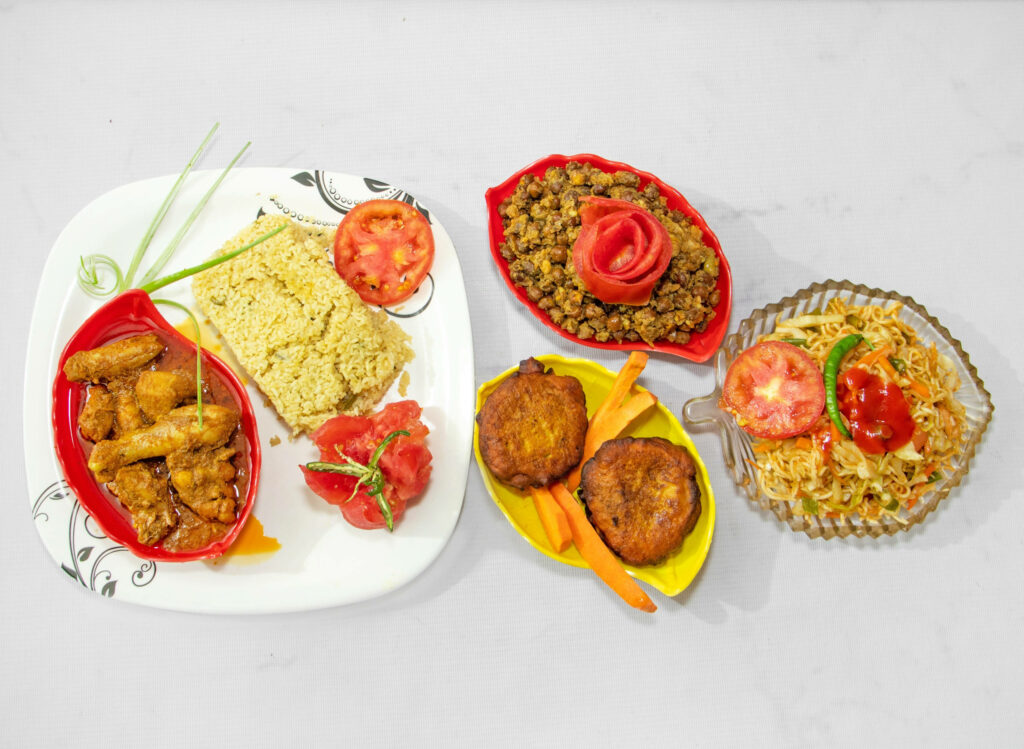 Colorful Flat Lay of Delicious Dishes: Curry, Noodles & More Wallpaper
