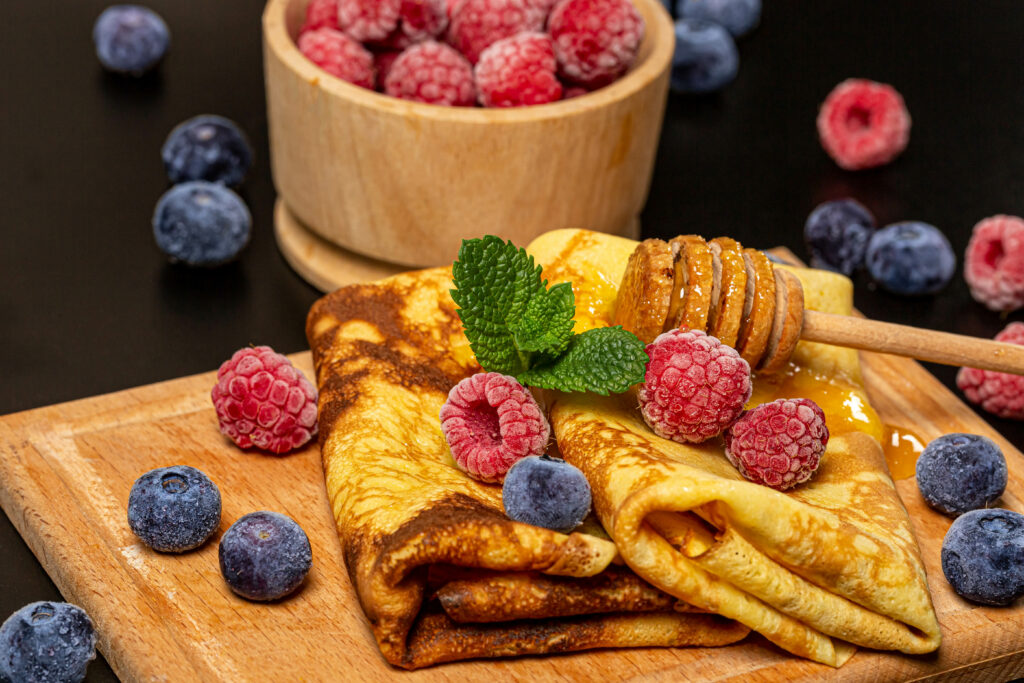Delicious Pancake Wallpaper with Raspberries, Blueberries & Honey