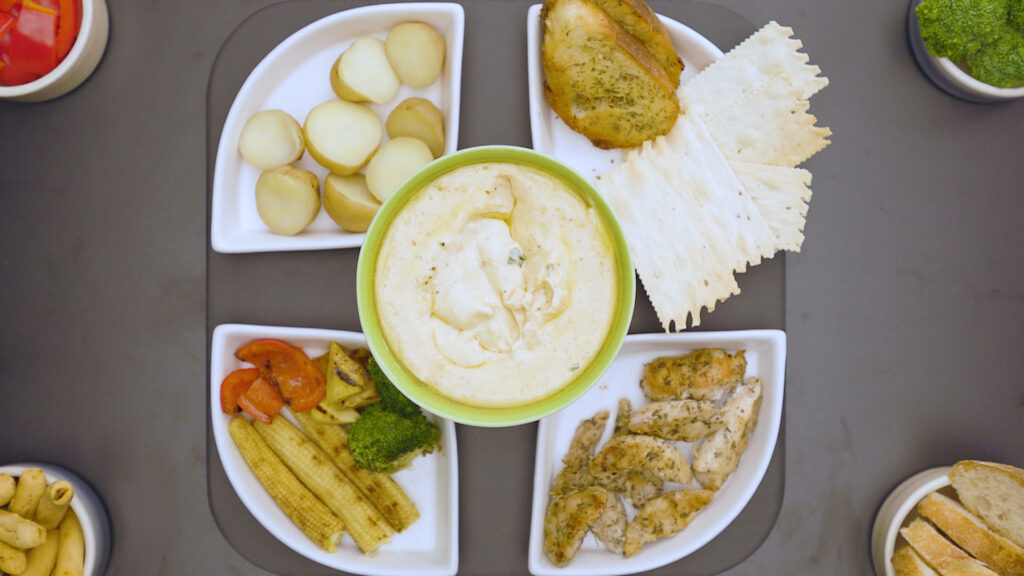 Creamy Fondue Wallpaper with Delicious Sides and Table Setting
