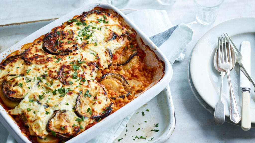Inviting Moussaka Tray: Freshly Baked & Herb-Garnished Wallpaper
