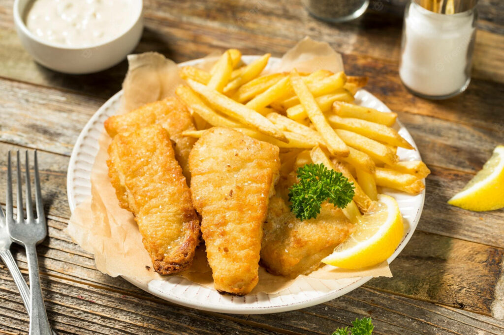 Crispy Golden-Brown Fried Fish with Fries & Lemon Wallpaper Background