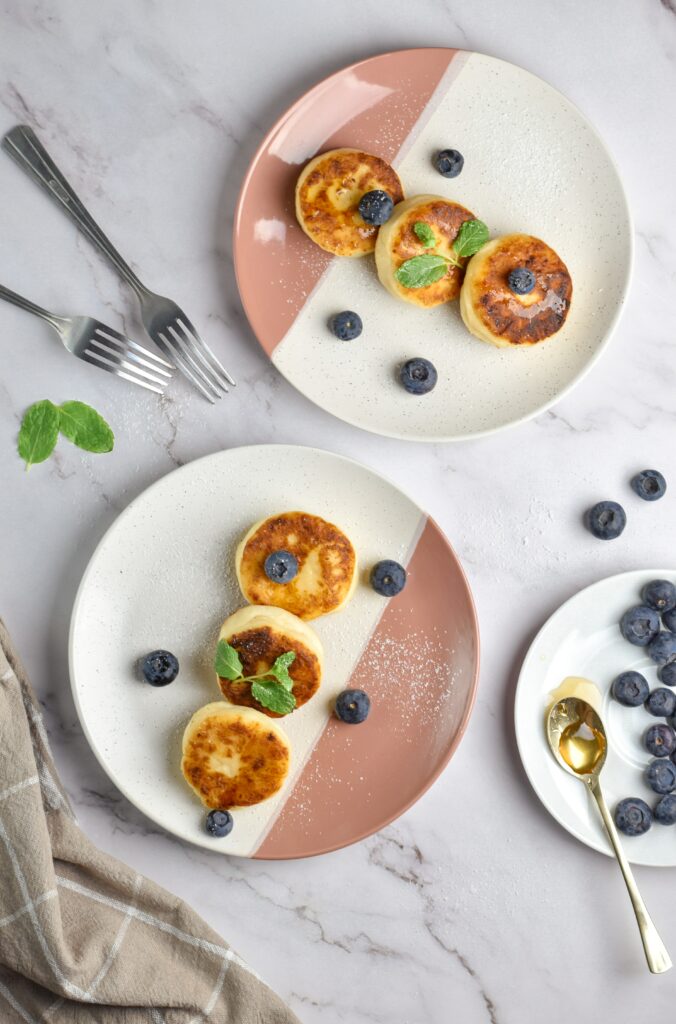 Delicious Golden Pancakes Wallpaper with Blueberries & Mint Leaves