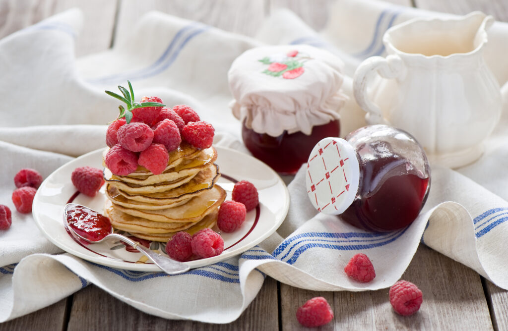 Delicious Pancakes with Raspberries & Syrup: Rustic Wallpaper Background