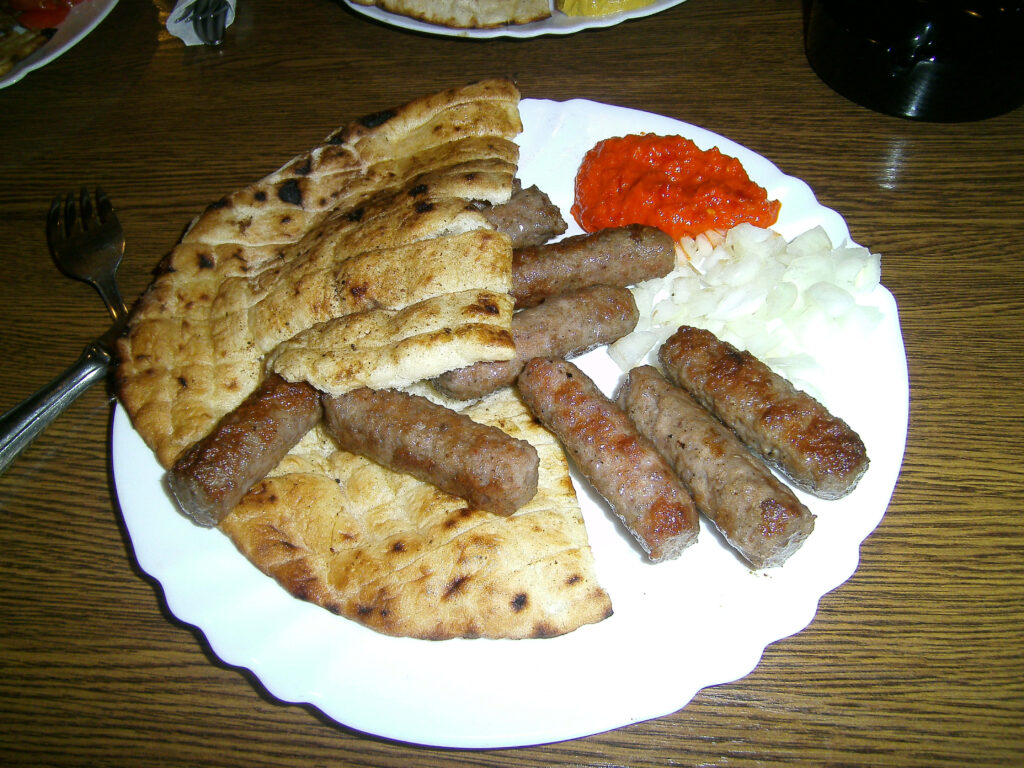 Delicious Grilled Ćevapi with Pita Wallpaper for Food Lovers