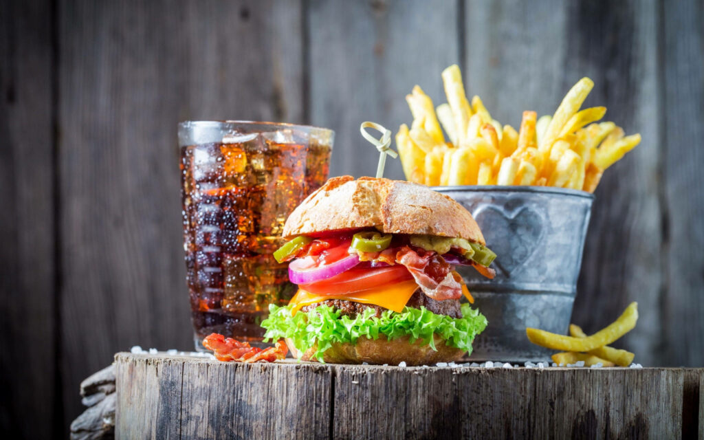 Delicious Grilled Cheeseburger with Fries & Iced Tea Wallpaper