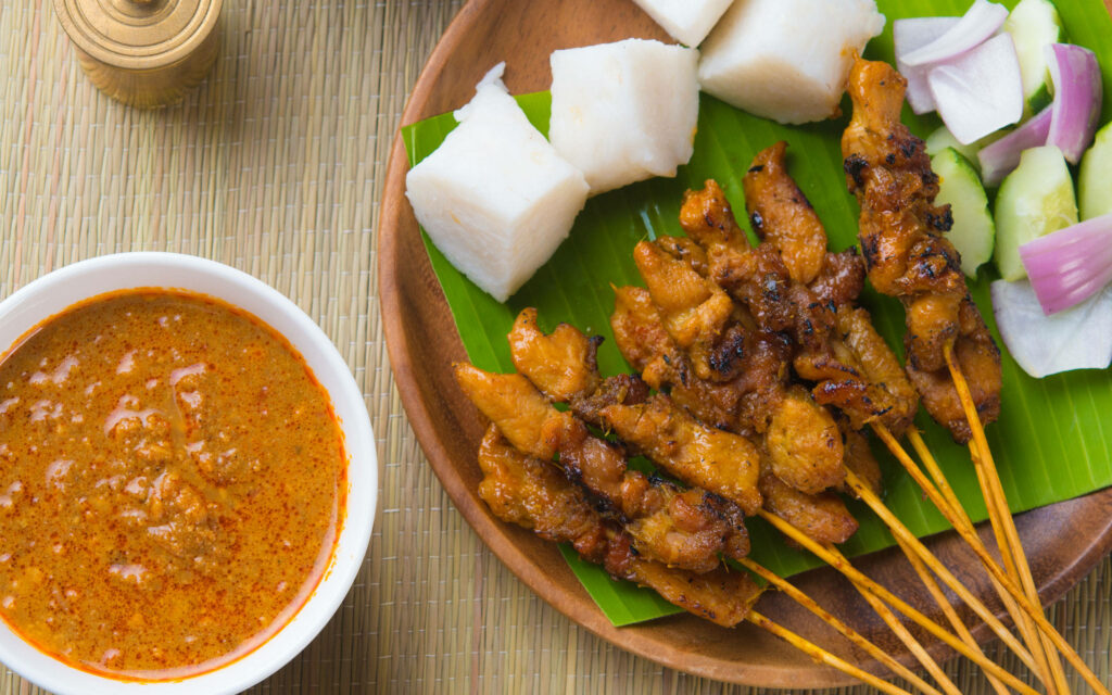 Mouthwatering Grilled Chicken Satay Wallpaper with Spicy Peanut Sauce