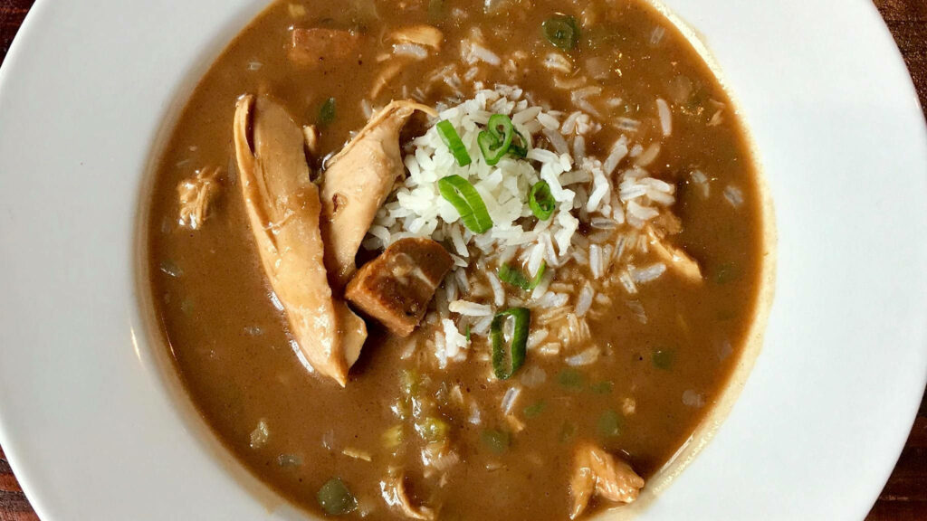 Delicious Gumbo Bowl with Chicken, Rice & Cheese - Hearty Wallpaper