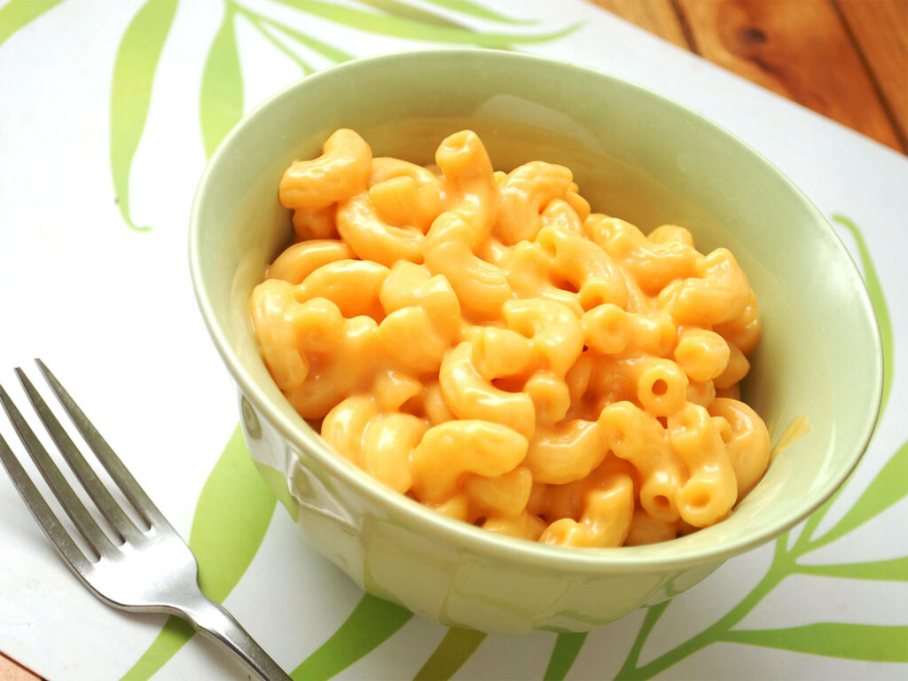 Cozy Mac and Cheese in Green Bowl - Cheesy Comfort Food Wallpaper