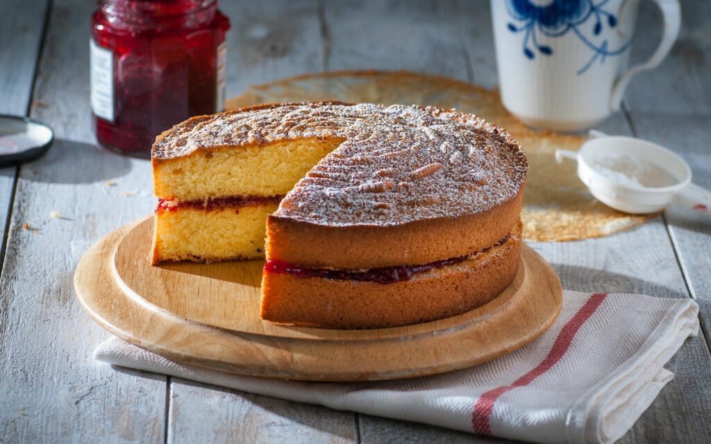Charming Homemade Sponge Cake with Jam & Powdered Sugar Wallpaper