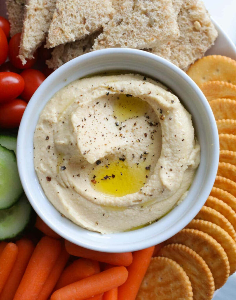 Wholesome Hummus Spread with Veggies and Crackers - Wallpaper Background
