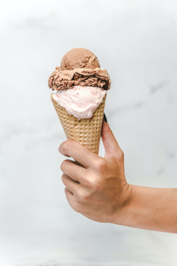 Delicious Hand-Held Chocolate & Vanilla Ice Cream Wallpaper Background