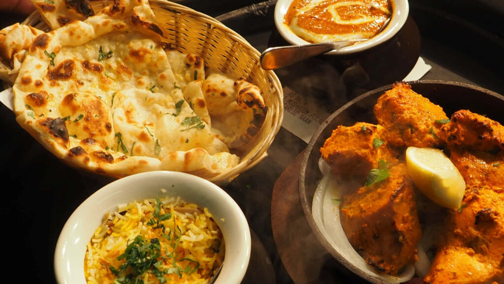 Delicious Indian Meal Wallpaper: Rice, Naan, Spiced Chicken & Curry