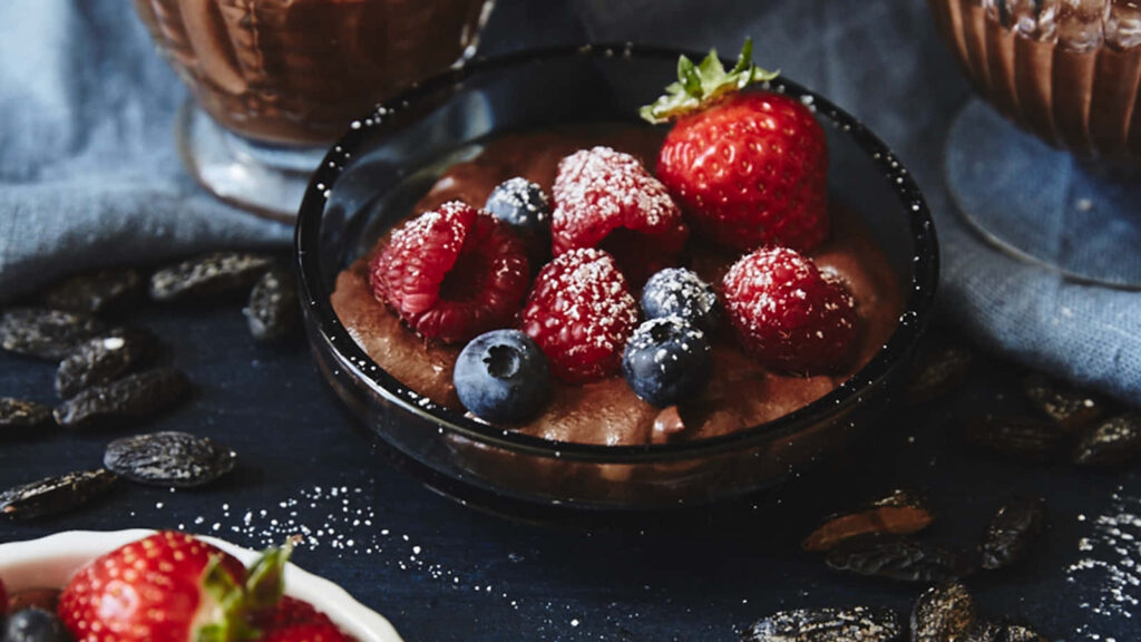 Sensational Sweet Delights: A Tempting Chocolate Mousse Ensemble adorned with Berries Wallpaper