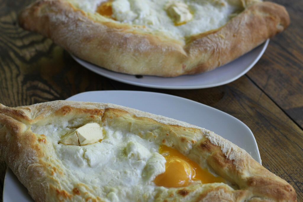 Delicious Khachapuri Wallpaper: Golden Crusts & Melted Cheese Delight