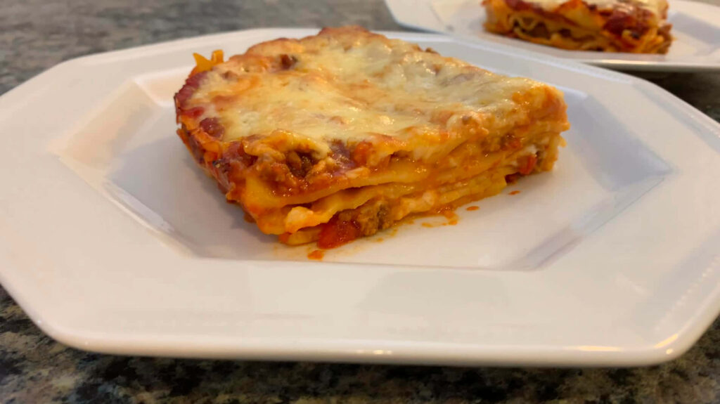 Delicious Lasagna Alla Bolognese - Stunning White Plate Wallpaper