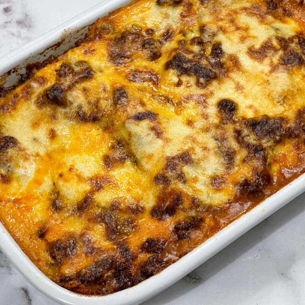 Rich Lasagna Alla Bolognese with Golden Cheese - Wallpaper Background