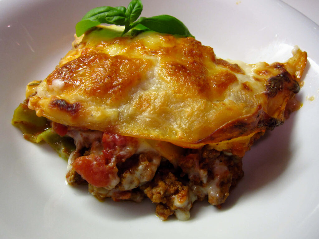 Delicious Lasagna Alla Bolognese Wallpaper: Cheese, Meat Sauce & Basil
