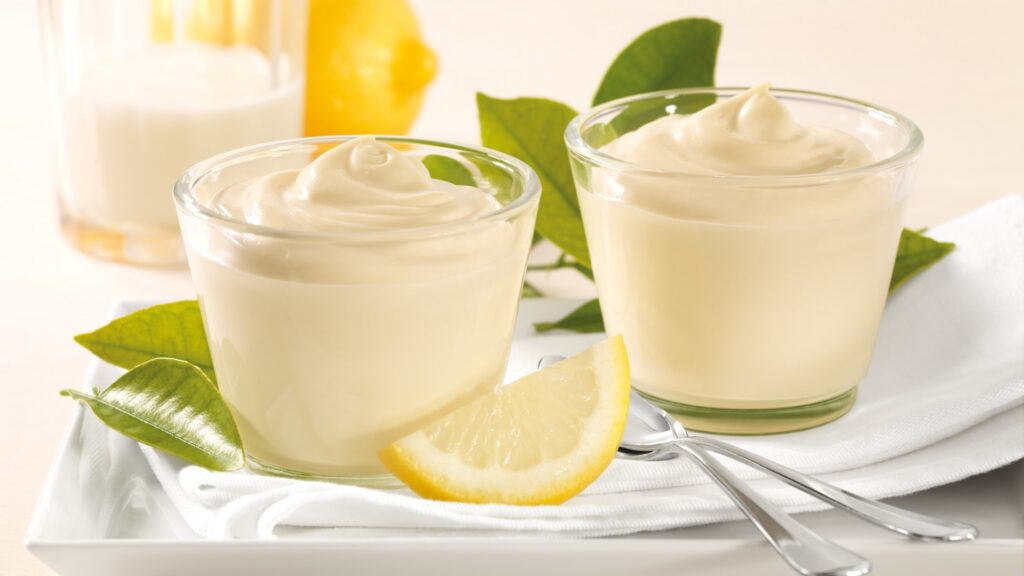 Refreshing Lemon Mousse Dessert in Glass Cups - Wallpaper Background