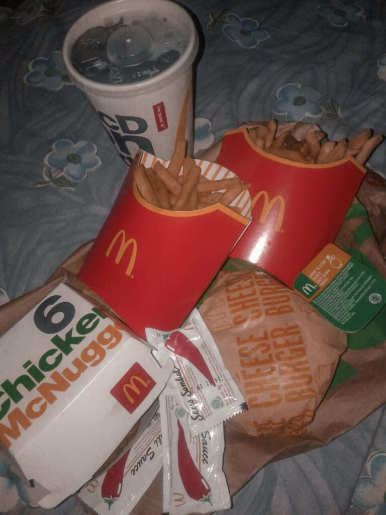 Delicious McDonald's Meal: Fries, Nuggets, Cheeseburger & Drink Wallpaper