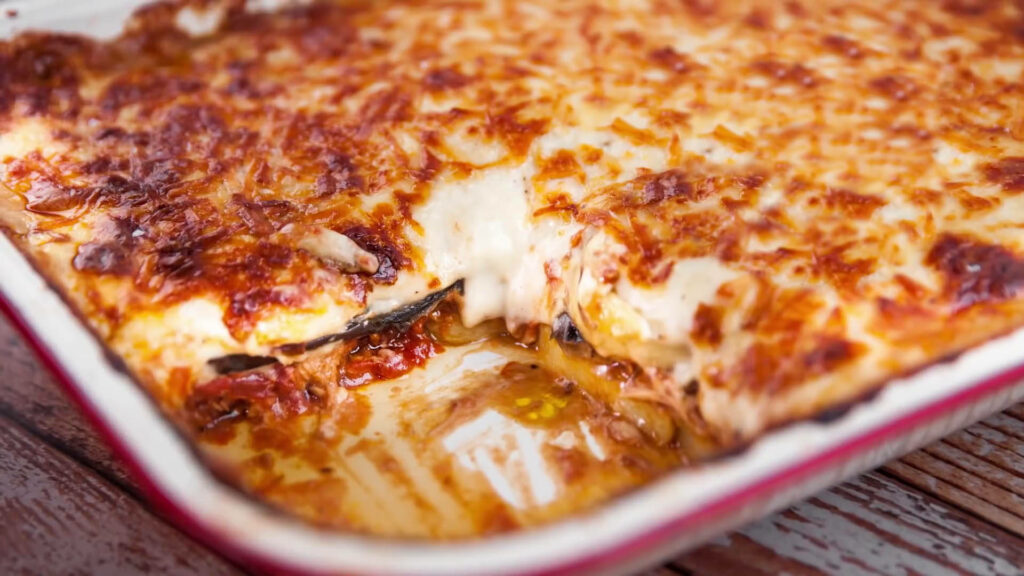 Delicious Moussaka Close-Up: Creamy Layers & Golden Cheese Wallpaper