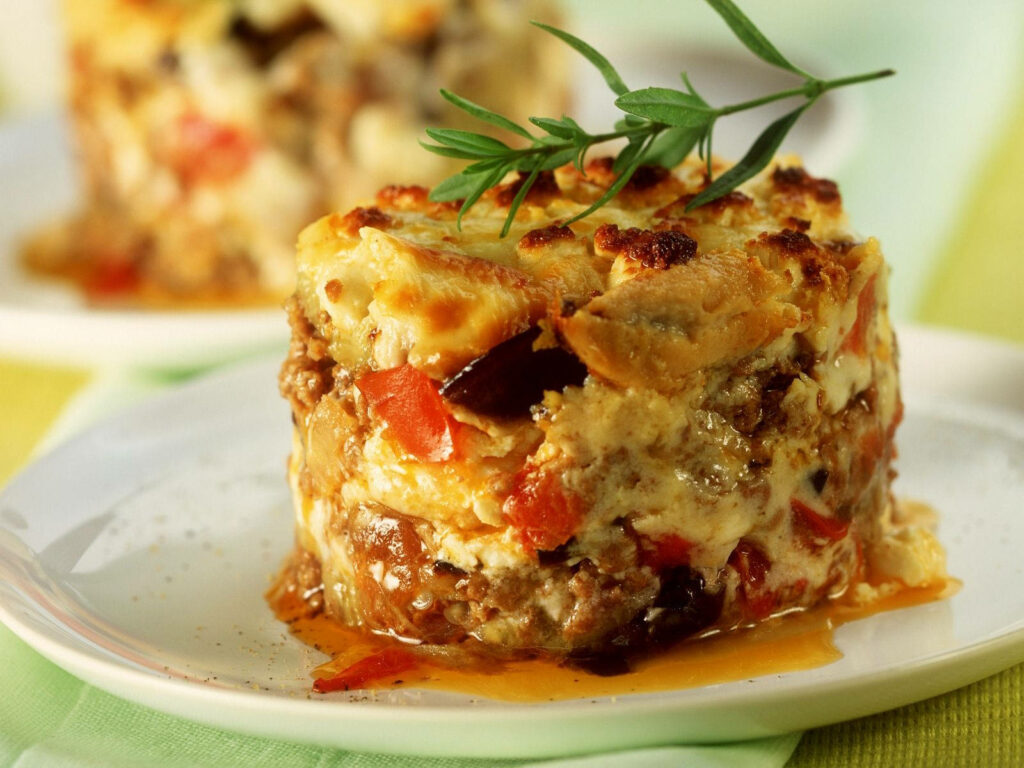 Delicious Moussaka Close-Up: Savory Layers & Golden Cheese Wallpaper