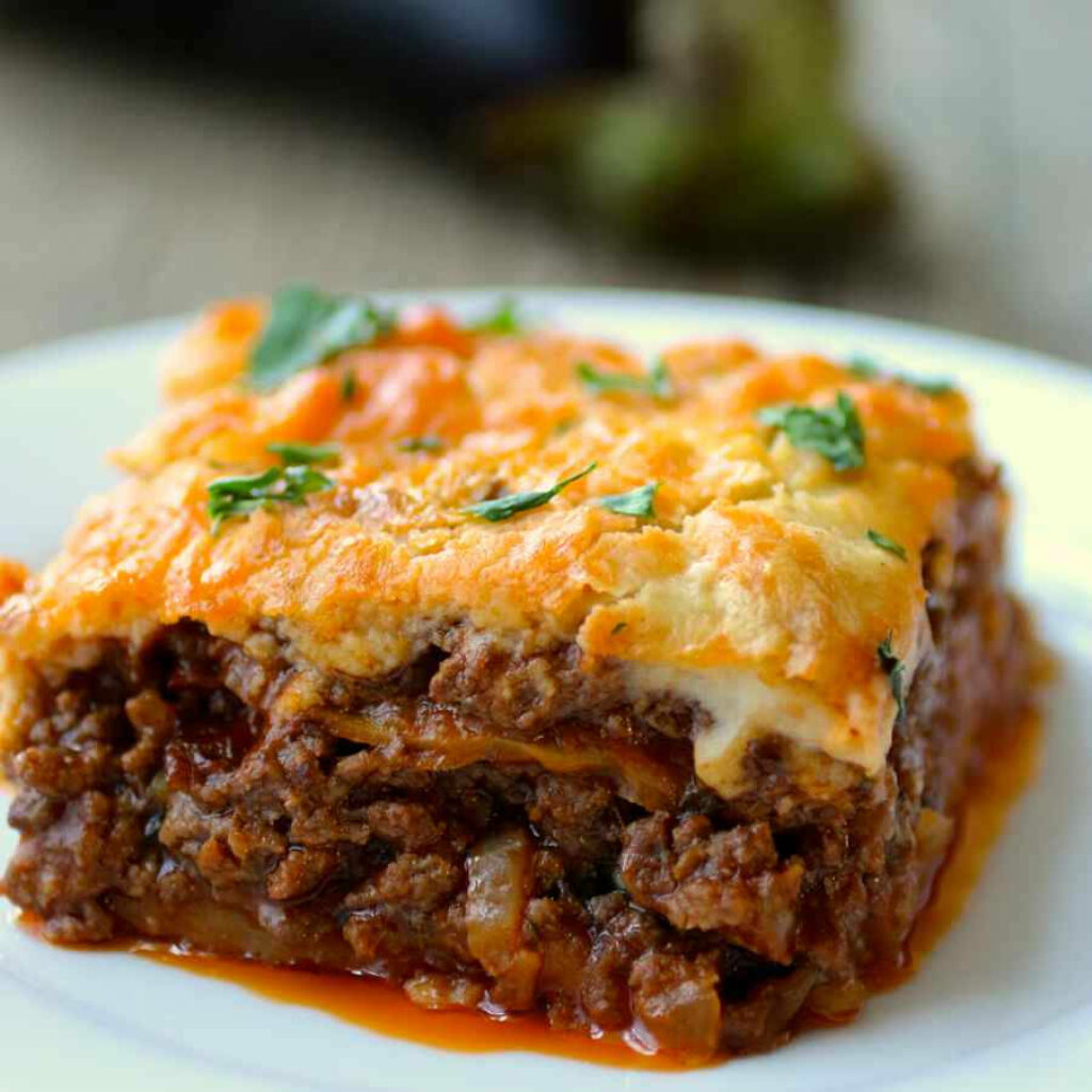 Freshly Baked Moussaka Close-Up: Savory Layers & Creamy Béchamel Wallpaper