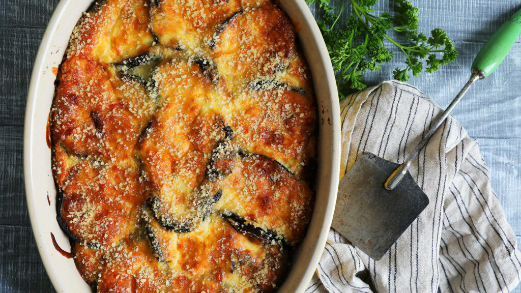 Delicious Moussaka with Golden Crust: Mouthwatering Wallpaper Background