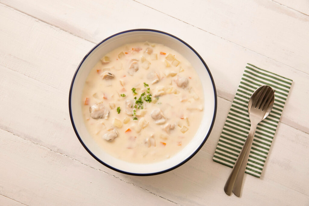 Creamy New England Clam Chowder in White Bowl - Wallpaper Background