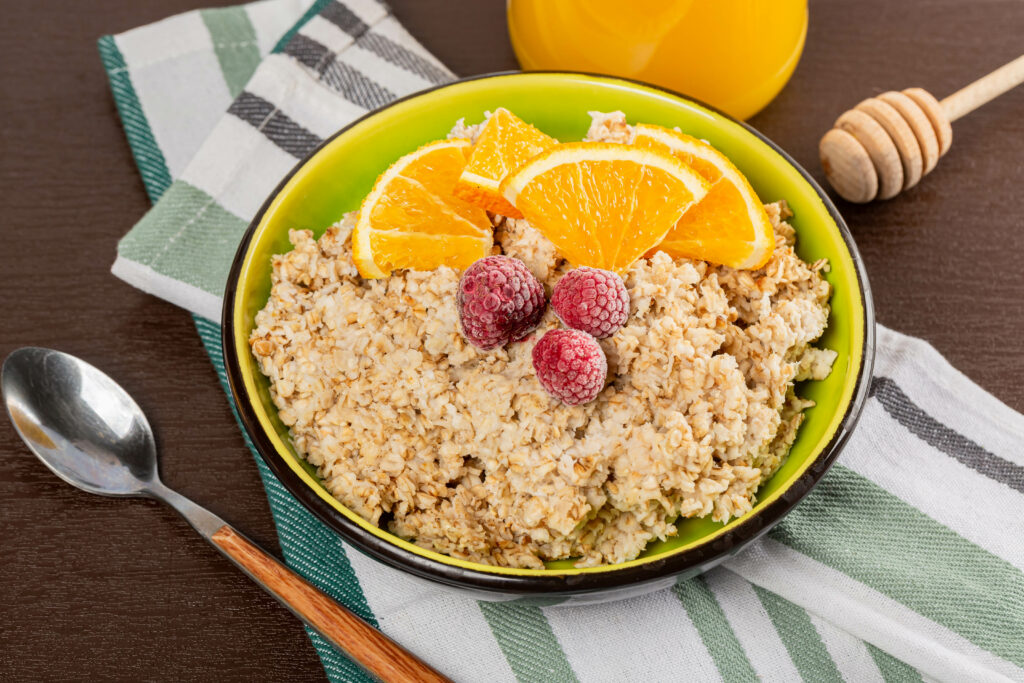 Delicious Breakfast Oatmeal Wallpaper with Raspberries & Orange Juice