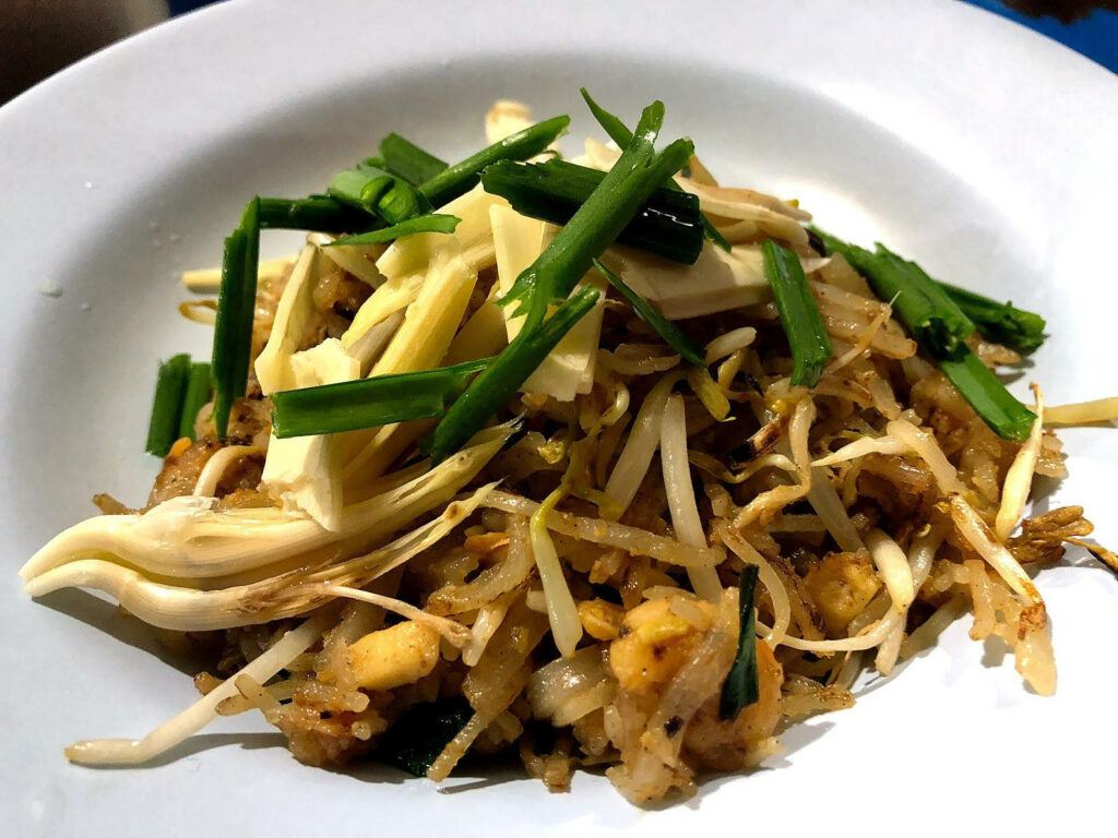 Delicious Pad Thai Noodles with Fresh Garnishes - Wallpaper Background