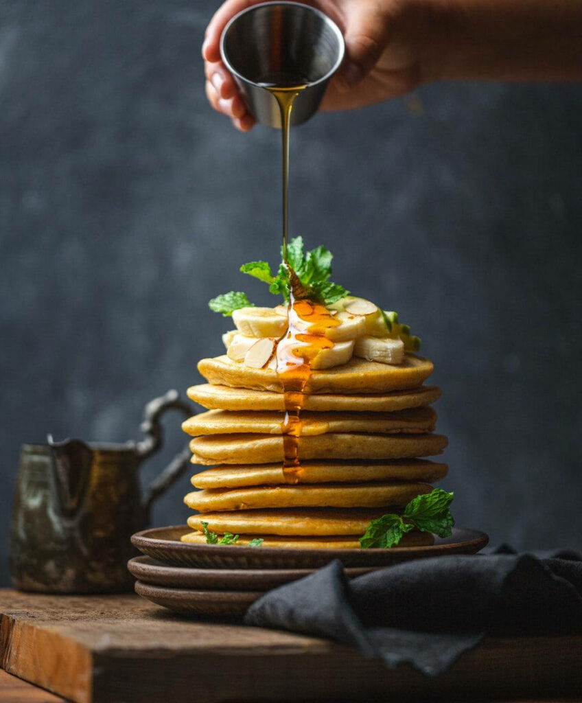 Delicious Pancake Wallpaper: Golden Stacks with Banana & Syrup