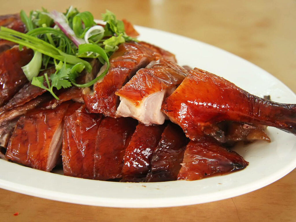 Elegant Peking Duck with Crispy Skin on White Plate - Wallpaper