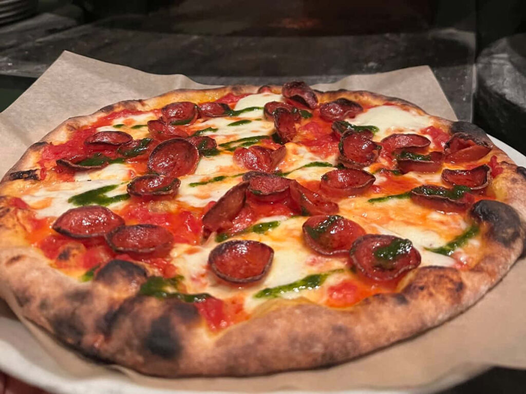 Delicious Pepperoni Pizza with Melted Cheese & Crispy Crust Wallpaper