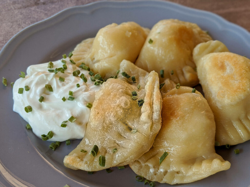 Freshly Cooked Pierogi with Creamy Mayo & Chives – Wallpaper Background