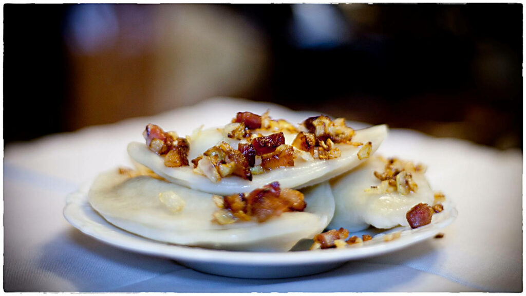 Delicious Pierogi Ruskie: Comforting Polish Dish with Onions & Bacon Wallpaper