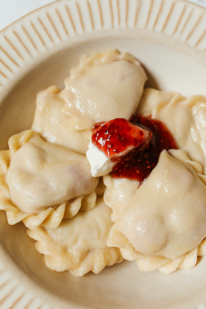 Delicious Pierogi with Strawberry Jam & Cream – Elegant Wallpaper