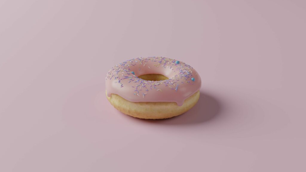 Colorful Donut Wallpaper: Delicious Pink Icing & Sprinkles Design