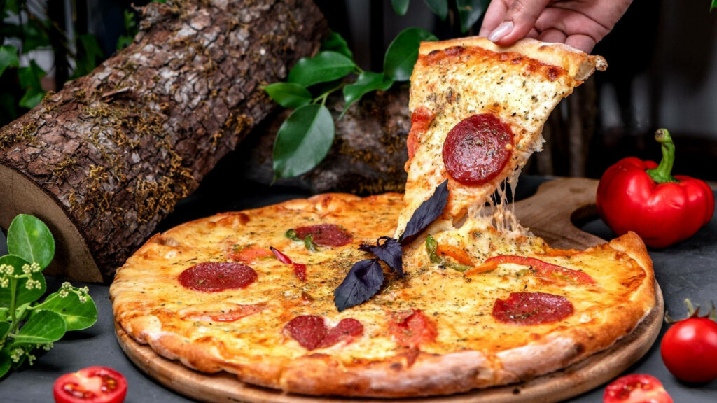 Freshly Baked Pepperoni Pizza Wallpaper with Vibrant Ingredients