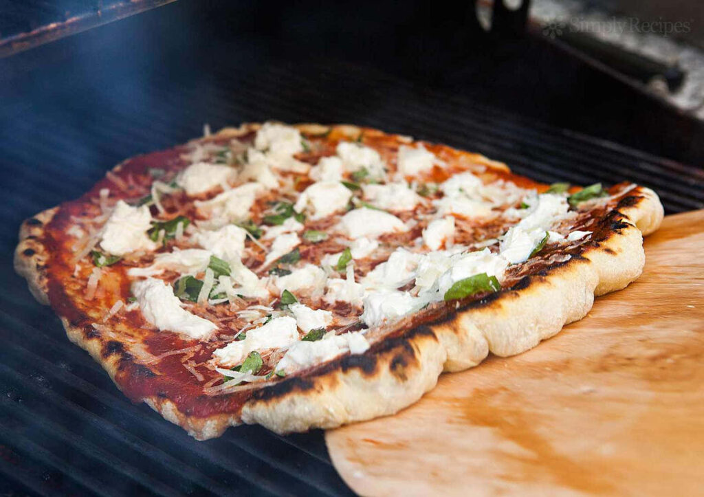Delicious Crispy Crust Pizza with Mozzarella & Basil - Wallpaper
