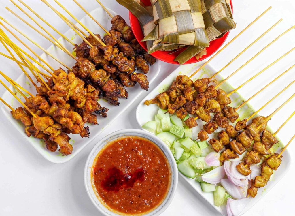 Delicious Pork Satay Skewers with Peanut Sauce - Wallpaper Background