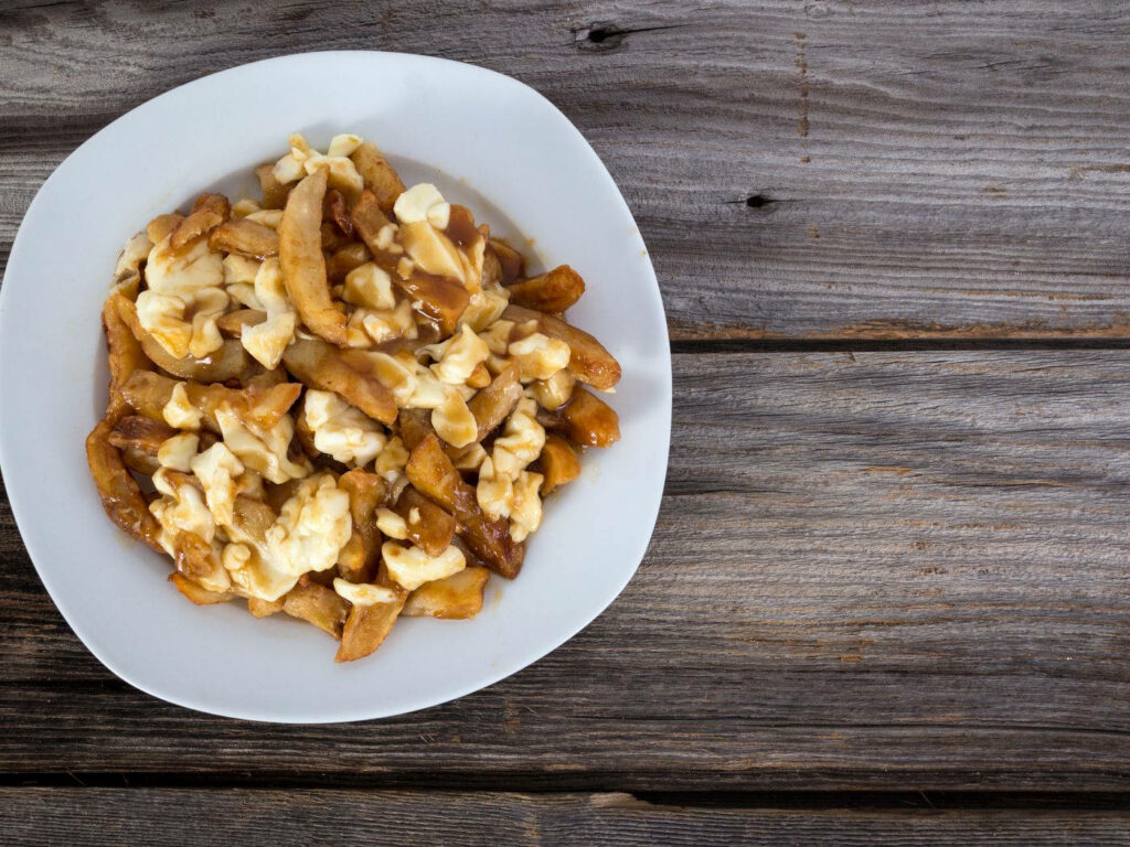 Authentic Poutine: Golden Fries, Cheese Curds & Gravy Wallpaper