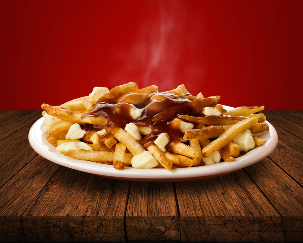 Delicious Poutine with Gravy & Cheese Curds on Red Wallpaper