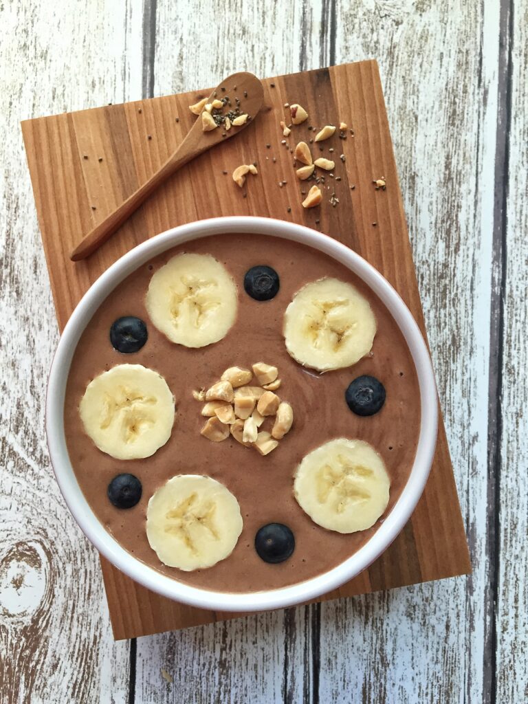 Delicious Banana Blueberry Pudding Wallpaper on Rustic Wood