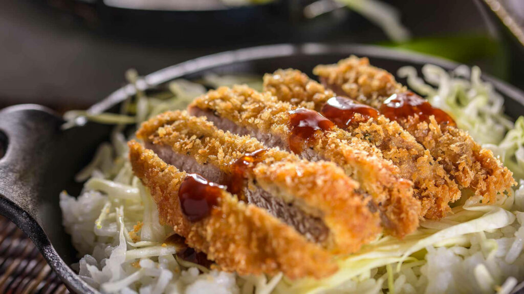 Delicious Tonkatsu Rice Wallpaper with Cabbage Slaw in Skillet