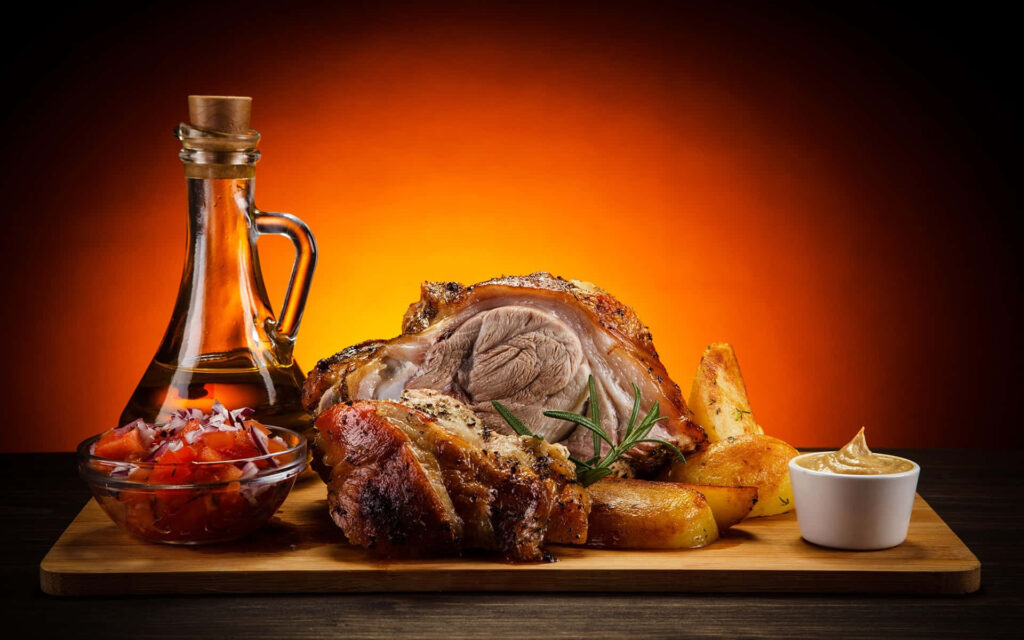 Delicious Roasted Meat & Potatoes Wallpaper with Tomato Salad