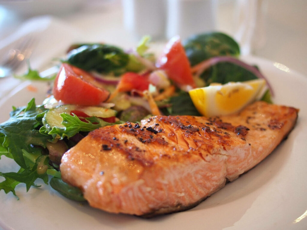 Delicious Salmon Dish with Colorful Salad - Fresh Wallpaper Background