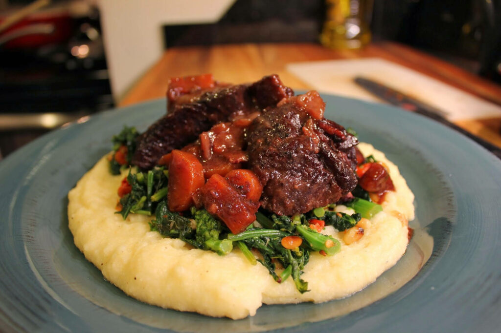 Delectable Short Ribs Wallpaper: Tender Ribs, Creamy Polenta & Greens