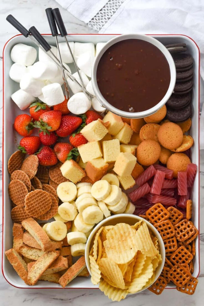 Colorful Fruit & Snack Tray Wallpaper - Sweet & Savory Delight