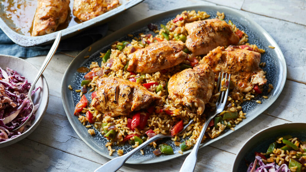 Spicy Peri Peri Chicken Rice Dish – Grilled Thighs & Vibrant Veggies Wallpaper